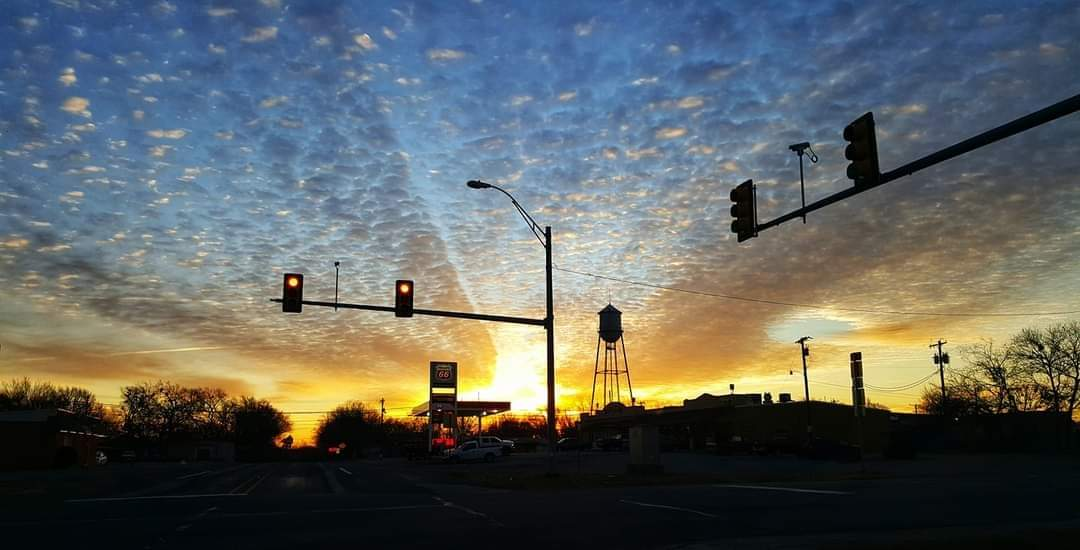 Stoplight and water tower at the intersection of highways 69 and 56 in Bells, Texas.